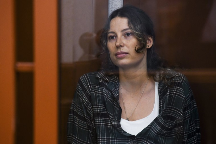 Ksenia Karelina sits in a defendant's cage in a court in Yekaterinburg, Russia, on Thursday, June 20, 2024. 